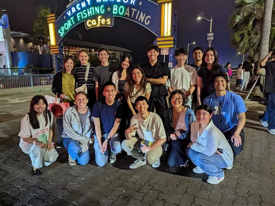 Group posing by the Santa Monica pier